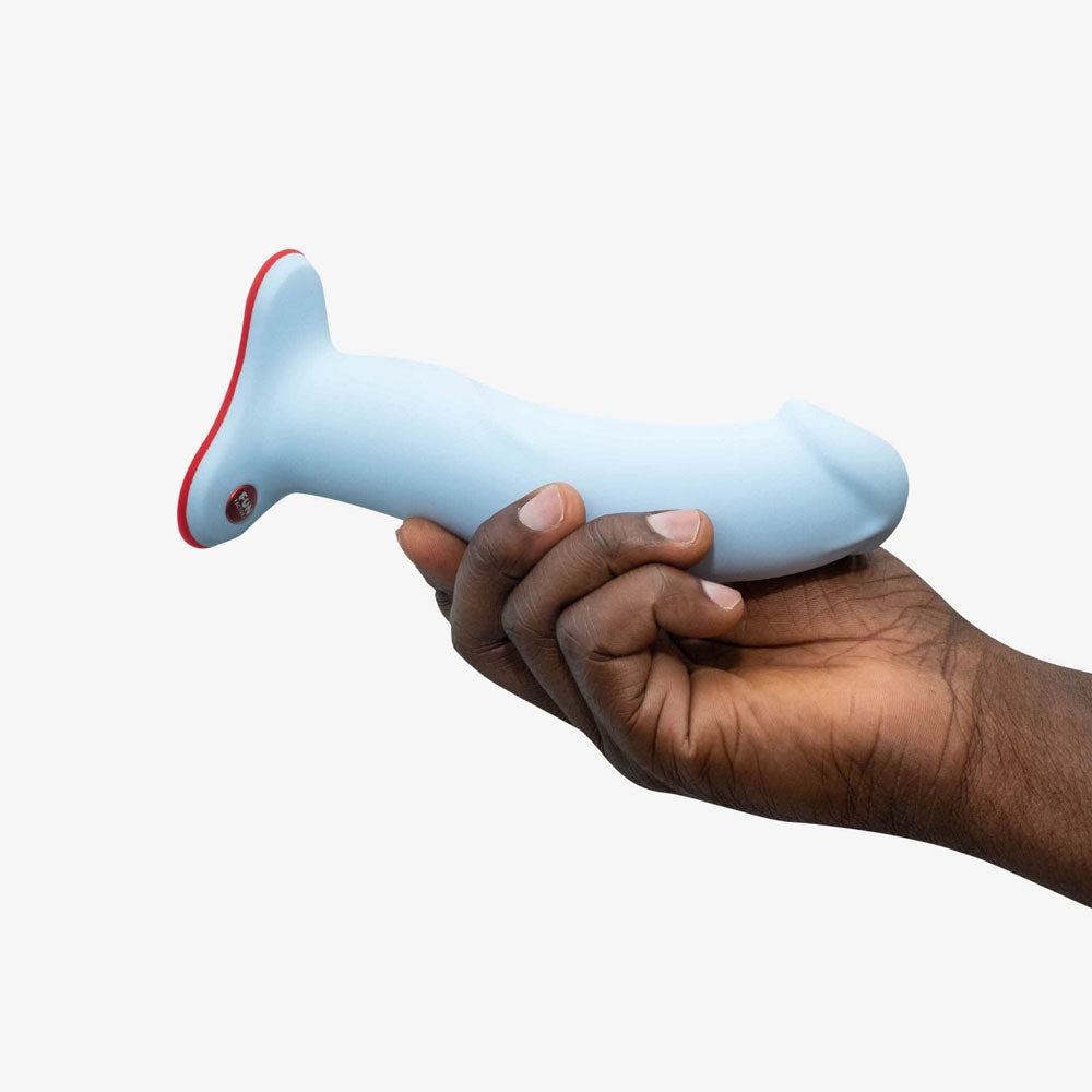 Side view of the Fun Factory The Boss Stub Dove Dildo 7" in a hand on white background | Flirty Bay, sex toys Australia
